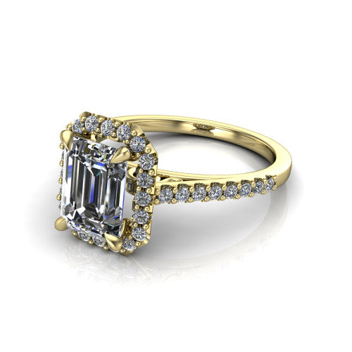 Birdie emerald halo engagement ring in 18K Yellow Gold, three-quarter perspective showing the haloed center above a slim pav&eacute; band with a filigree gallery