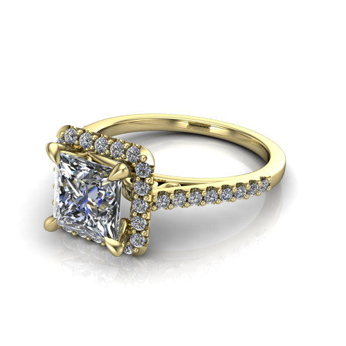 Birdie princess halo engagement ring in 18K Yellow Gold, three-quarter perspective showing the haloed center above a slim pav&eacute; band with a filigree gallery