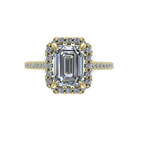 Birdie emerald halo engagement ring in 18K Yellow Gold, top-down view showing the center framed by a emerald pav&eacute; halo with compass prongs