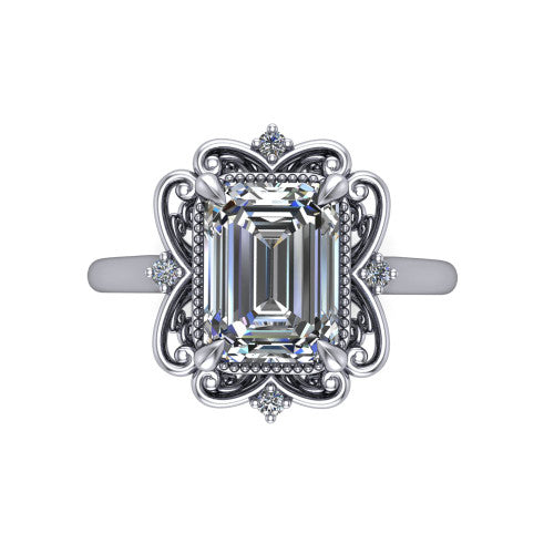 Gracelyn emerald halo engagement ring in Platinum, top-down view showing the center diamond within an open carved filigree halo with fleur-de-lis corners