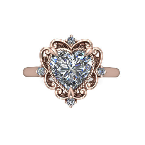 Gracelyn heart halo engagement ring in 14K Rose Gold, top-down view showing the center diamond within an open carved filigree halo with fleur-de-lis corners