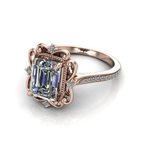 Remington emerald vintage halo engagement ring in 18K Rose Gold with ornate floral filigree halo and pavé band, three-quarter perspective view
