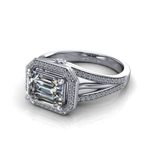 Brinley emerald vintage halo engagement ring in 18K White Gold with bezel-edged milgrain halo and pavé split shank, three-quarter perspective view