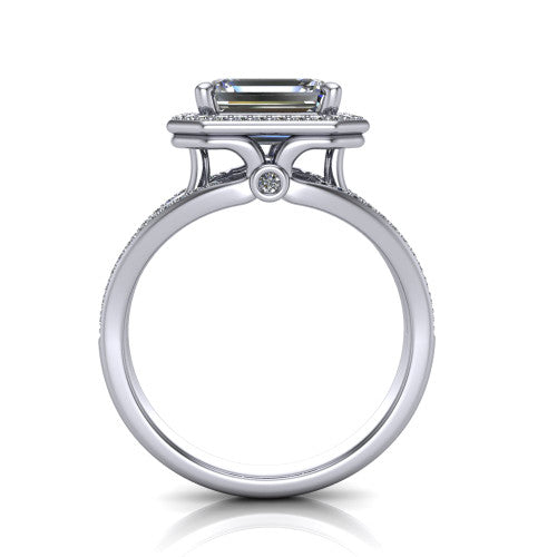 Brinley emerald vintage halo engagement ring in Platinum with bezel-edged milgrain halo and pavé split shank, through-finger front profile showing the bezel-set accent