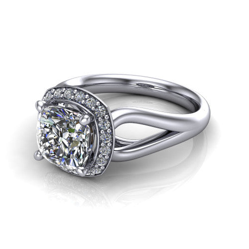 Daleyza cushion halo engagement ring in Platinum, three-quarter perspective showing the cushion center diamond, pave halo, and polished split-shank band