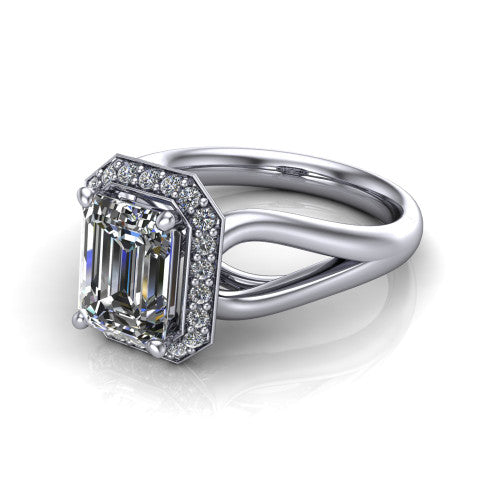 Daleyza emerald-cut halo engagement ring in 18K White Gold, three-quarter perspective showing the emerald-cut center diamond, pave halo, and polished split-shank band