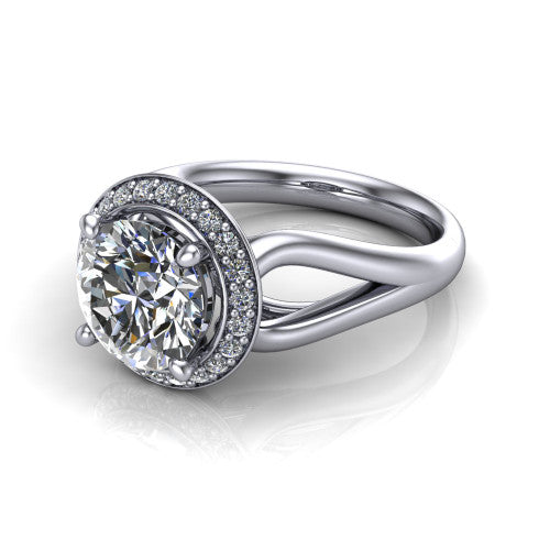 Daleyza round halo engagement ring in Platinum, three-quarter perspective showing the round center diamond, pave halo, and polished split-shank band