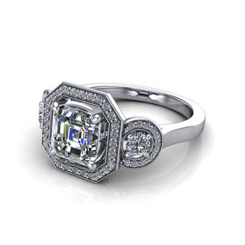 Colette square emerald-cut three-stone halo engagement ring in 14K White Gold, three-quarter perspective showing the square emerald-cut center diamond and two round side stones, each in a pave halo, across the band