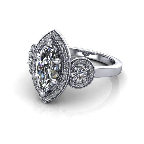 Colette marquise three-stone halo engagement ring in 18K White Gold, three-quarter perspective showing the marquise center diamond and two round side stones, each in a pave halo, across the band