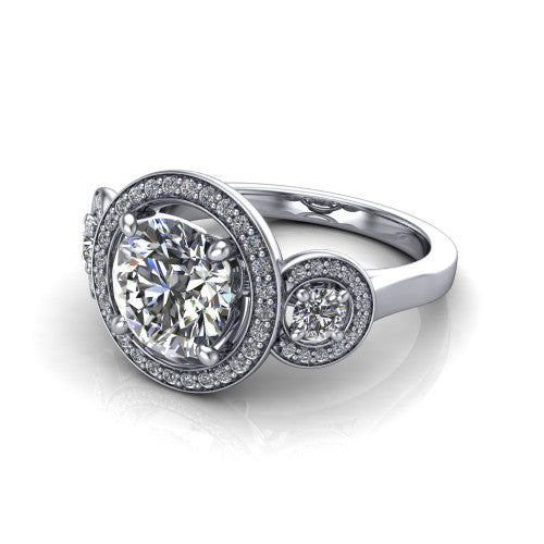 Colette round three-stone halo engagement ring in 14K White Gold, three-quarter perspective showing the round center diamond and two round side stones, each in a pave halo, across the band