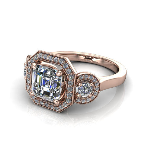 Colette square emerald-cut three-stone halo engagement ring in 14K Rose Gold, three-quarter perspective showing the square emerald-cut center diamond and two round side stones, each in a pave halo, across the band