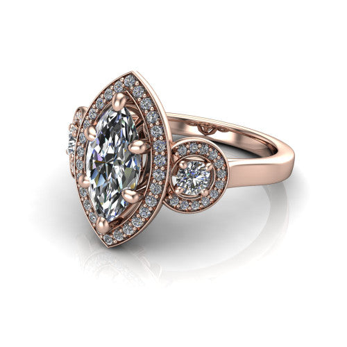 Colette marquise three-stone halo engagement ring in 18K Rose Gold, three-quarter perspective showing the marquise center diamond and two round side stones, each in a pave halo, across the band