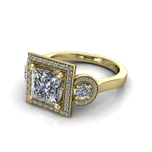 Colette princess-cut three-stone halo engagement ring in 18K Yellow Gold, three-quarter perspective showing the princess-cut center diamond and two round side stones, each in a pave halo, across the band