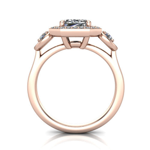 Colette emerald-cut three-stone halo engagement ring in 18K Rose Gold, through-finger front profile showing the haloed stones and open under-gallery from the front