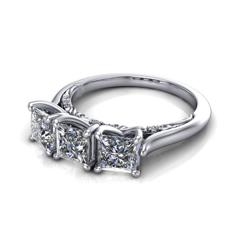 Kora princess-cut three-stone engagement ring in 14K White Gold, three-quarter perspective showing the three matched princess-cut diamonds, pave-set band, and vintage scrollwork gallery