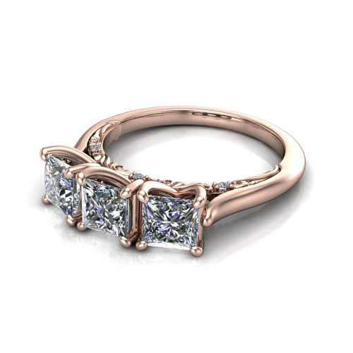 Kora princess-cut three-stone engagement ring in 14K Rose Gold, three-quarter perspective showing the three matched princess-cut diamonds, pave-set band, and vintage scrollwork gallery