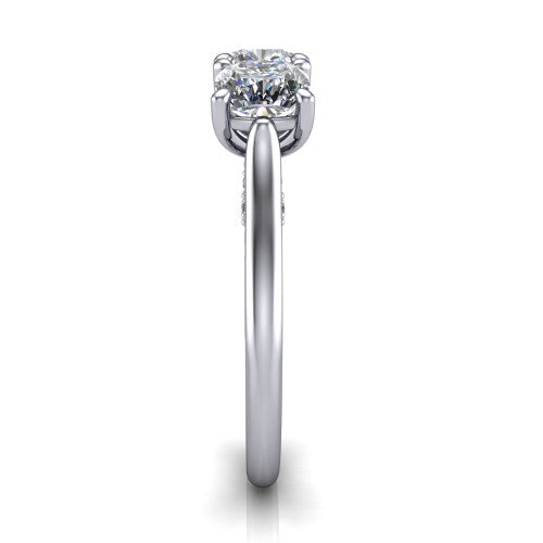 Kora cushion three-stone engagement ring in Platinum, side profile showing the pave-set band, scrollwork gallery, and high-polish profile