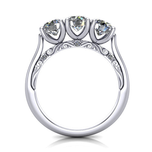 Kora round three-stone engagement ring in Platinum, through-finger front profile showing the open scrollwork under-gallery and pave-set accents