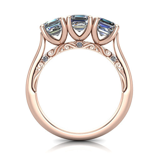 Kora square emerald-cut three-stone engagement ring in 14K Rose Gold, through-finger front profile showing the open scrollwork under-gallery and pave-set accents