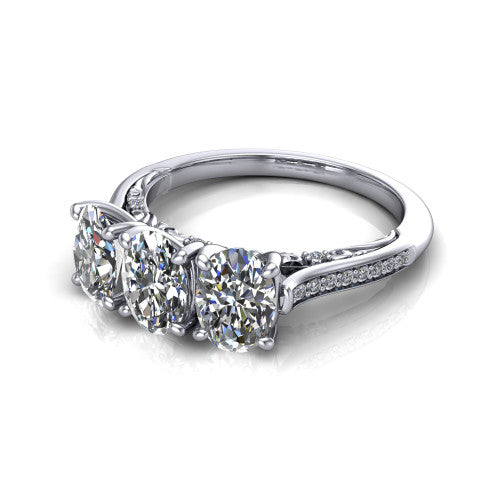 Emory oval three-stone engagement ring in Platinum, three-quarter perspective showing the three matched oval diamonds, pave-set band, and filigree under-gallery