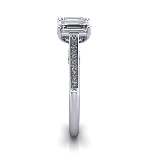 Emory emerald-cut three-stone engagement ring in 18K White Gold, side profile showing the pave-set band, filigree gallery, and high-polish profile