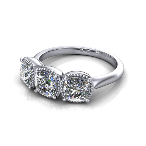 Evangeline cushion three-stone engagement ring in 14K White Gold, three-quarter perspective showing three cushion diamonds in milgrain bezels on a polished tapered band