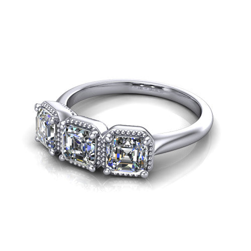 Evangeline square emerald-cut three-stone engagement ring in 14K White Gold, three-quarter perspective showing three square emerald-cut diamonds in milgrain bezels on a polished tapered band