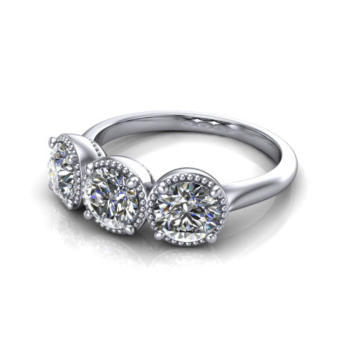 Evangeline round three-stone engagement ring in Platinum, three-quarter perspective showing three round diamonds in milgrain bezels on a polished tapered band