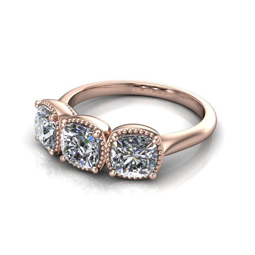 Evangeline cushion three-stone engagement ring in 18K Rose Gold, three-quarter perspective showing three cushion diamonds in milgrain bezels on a polished tapered band