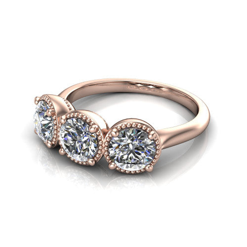 Evangeline round three-stone engagement ring in 18K Rose Gold, three-quarter perspective showing three round diamonds in milgrain bezels on a polished tapered band