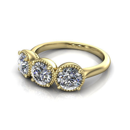 Evangeline round three-stone engagement ring in 18K Yellow Gold, three-quarter perspective showing three round diamonds in milgrain bezels on a polished tapered band