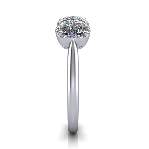 Evangeline cushion three-stone engagement ring in Platinum, side profile showing the milgrain bezels and clean polished band in profile