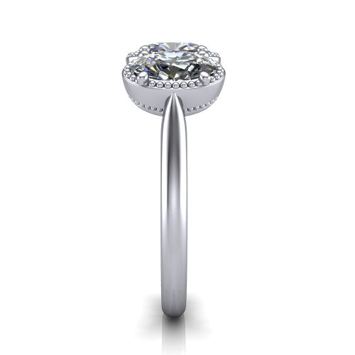 Evangeline oval three-stone engagement ring in 14K White Gold, side profile showing the milgrain bezels and clean polished band in profile