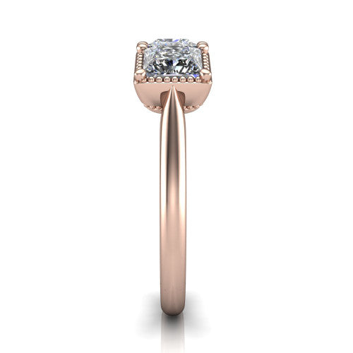 Evangeline princess-cut three-stone engagement ring in 18K Rose Gold, side profile showing the milgrain bezels and clean polished band in profile