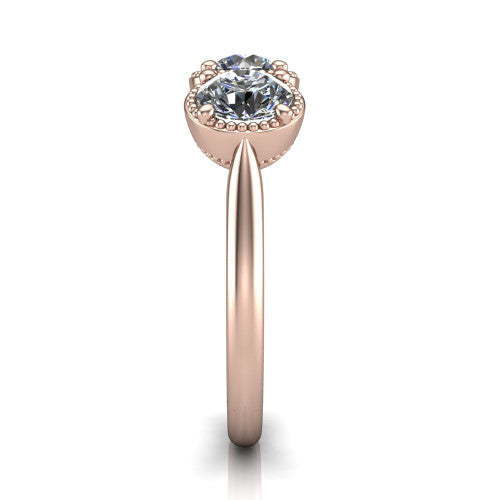 Evangeline round three-stone engagement ring in 18K Rose Gold, side profile showing the milgrain bezels and clean polished band in profile