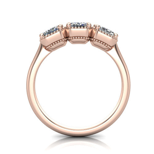 Evangeline emerald-cut three-stone engagement ring in 14K Rose Gold, through-finger front profile showing the milgrain bezels and open under-gallery from the front
