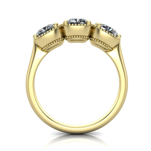 Evangeline cushion three-stone engagement ring in 14K Yellow Gold, through-finger front profile showing the milgrain bezels and open under-gallery from the front