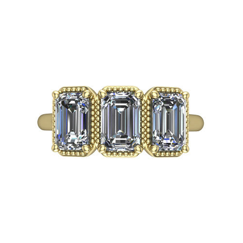 Evangeline emerald-cut three-stone engagement ring in 18K Yellow Gold, top-down view showing the three emerald-cut diamonds set side by side in milgrain bezels