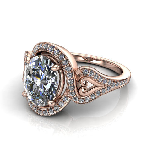 Elisa oval vintage halo engagement ring in 14K Rose Gold, three-quarter perspective showing the oval center diamond, pave halo, and vintage filigree heart-scroll shoulders