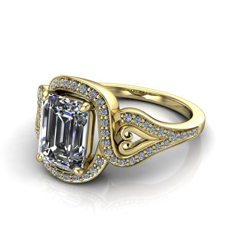 Elisa emerald-cut vintage halo engagement ring in 14K Yellow Gold, three-quarter perspective showing the emerald-cut center diamond, pave halo, and vintage filigree heart-scroll shoulders