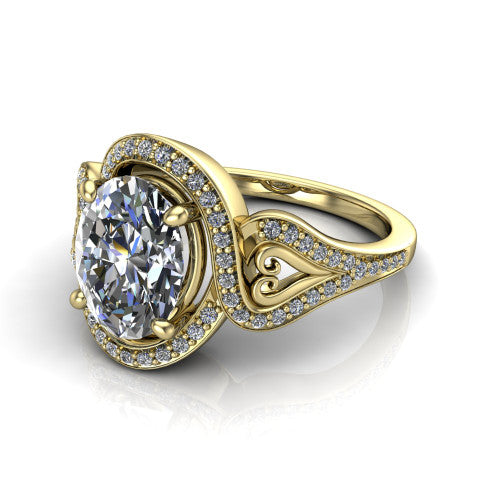 Elisa oval vintage halo engagement ring in 18K Yellow Gold, three-quarter perspective showing the oval center diamond, pave halo, and vintage filigree heart-scroll shoulders