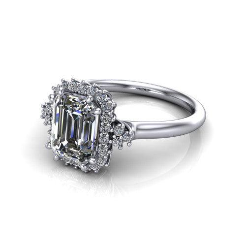Elaine emerald-cut floral halo engagement ring in 14K White Gold, three-quarter perspective showing the emerald-cut center diamond framed by the floral pave halo and shoulder accents