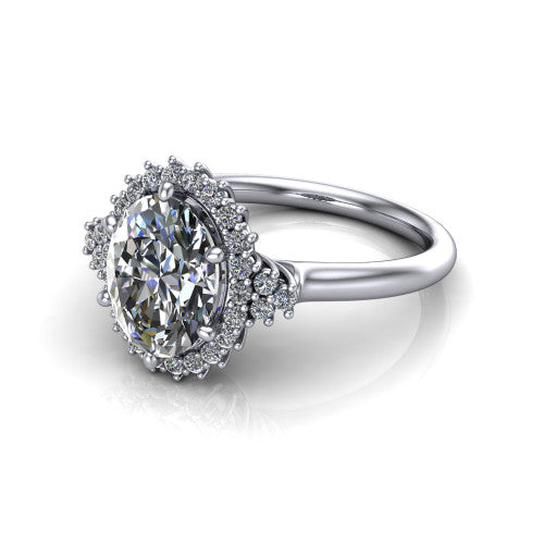 Elaine oval floral halo engagement ring in Platinum, three-quarter perspective showing the oval center diamond framed by the floral pave halo and shoulder accents