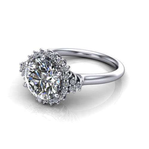 Elaine round floral halo engagement ring in 18K White Gold, three-quarter perspective showing the round center diamond framed by the floral pave halo and shoulder accents