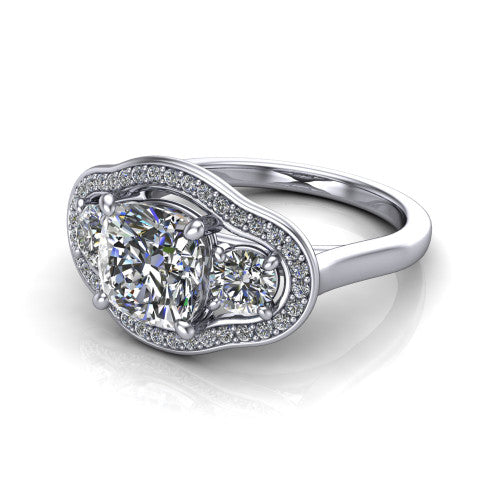 Makayla cushion three-stone halo engagement ring in 18K White Gold, three-quarter perspective showing the cushion center diamond, two side stones, and individual pave halos on the east-west gallery