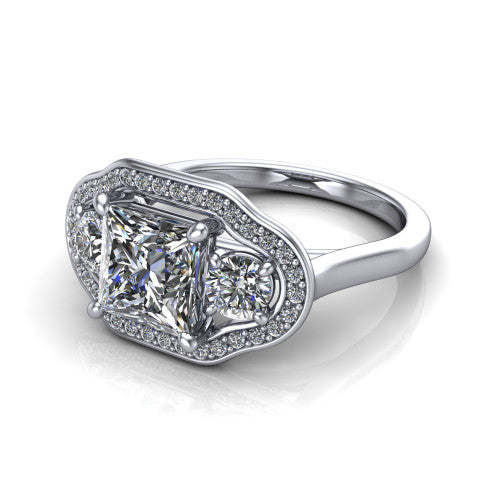 Makayla princess-cut three-stone halo engagement ring in 14K White Gold, three-quarter perspective showing the princess-cut center diamond, two side stones, and individual pave halos on the east-west gallery