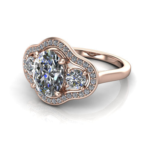 Makayla oval three-stone halo engagement ring in 14K Rose Gold, three-quarter perspective showing the oval center diamond, two side stones, and individual pave halos on the east-west gallery