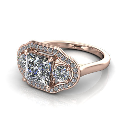 Makayla princess-cut three-stone halo engagement ring in 14K Rose Gold, three-quarter perspective showing the princess-cut center diamond, two side stones, and individual pave halos on the east-west gallery
