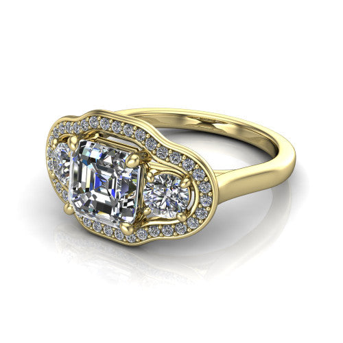 Makayla square emerald-cut three-stone halo engagement ring in 14K Yellow Gold, three-quarter perspective showing the square emerald-cut center diamond, two side stones, and individual pave halos on the east-west gallery