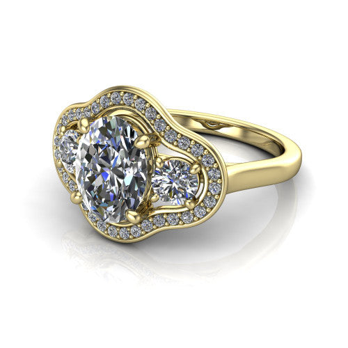 Makayla oval three-stone halo engagement ring in 18K Yellow Gold, three-quarter perspective showing the oval center diamond, two side stones, and individual pave halos on the east-west gallery
